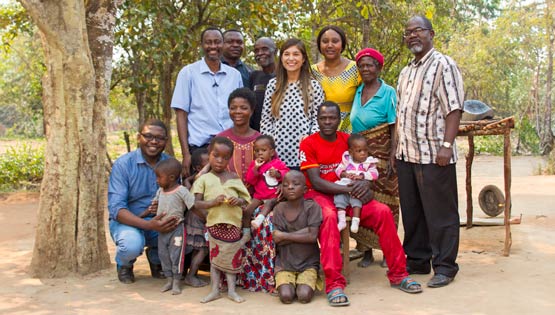 A large group of people pose for a photo in Africa