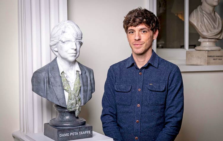 Artist pictured with sculpture