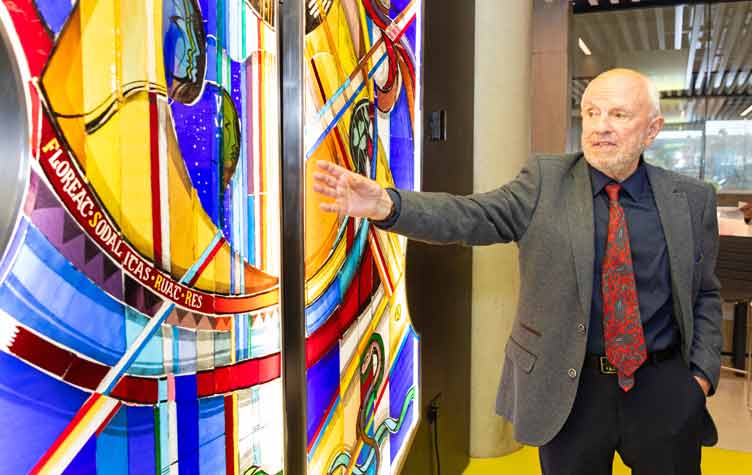 Artist and his stained glass creation