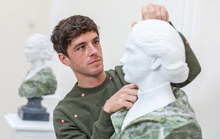 Sculptor with his bust artwork