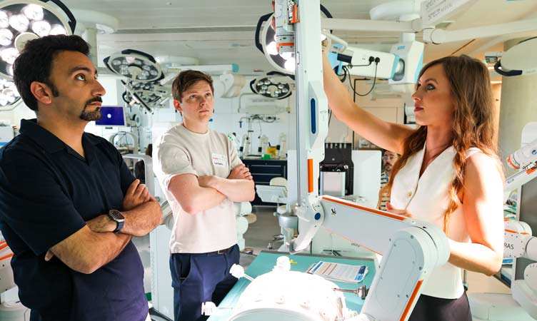 A woman smiles during a robotic workshop session