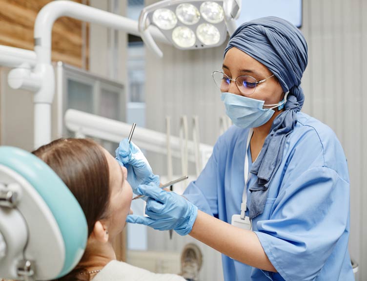 Dentist and patient in clinic