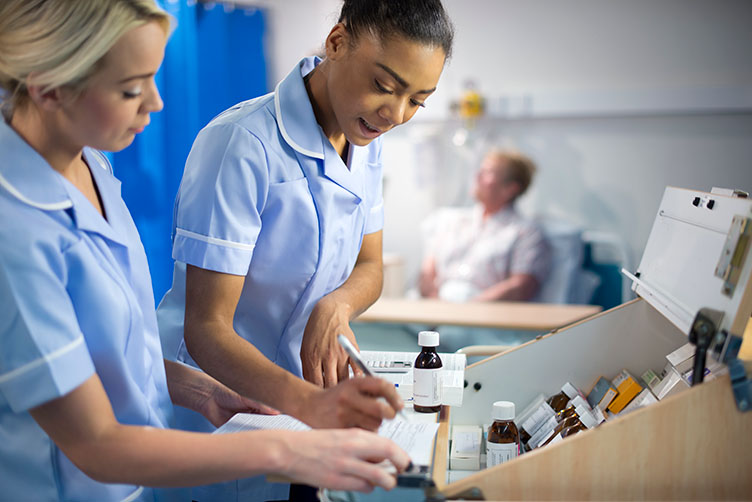 Two nurses organising medication