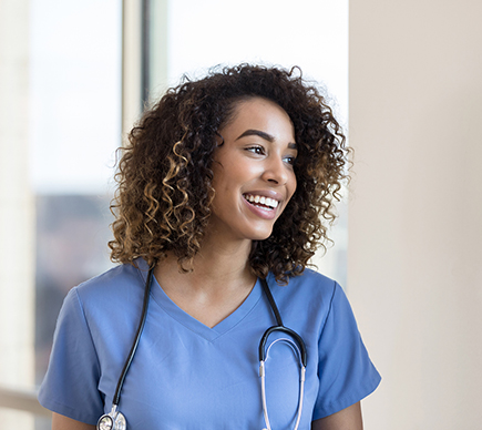 A female doctor, smiling.