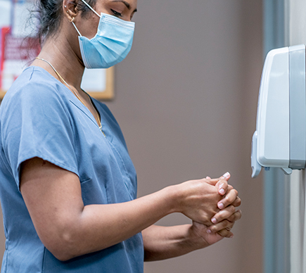 A nurse washing her hands.