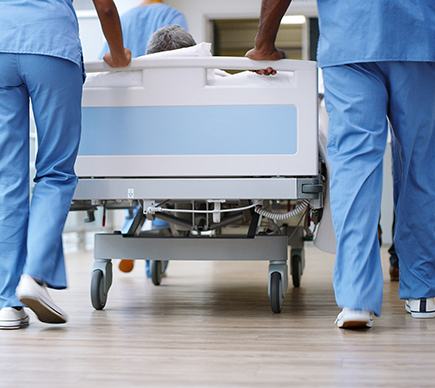 A patient being brought to theatre on a stretcher.