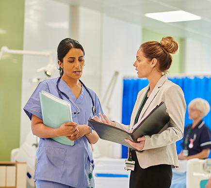 Colleagues conferring in a hospital.