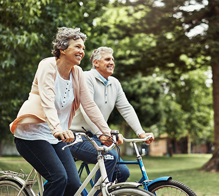 A man and a woman cycling.