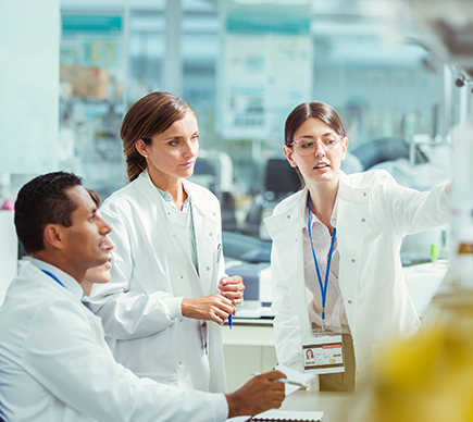 Three medical professionals conferring.