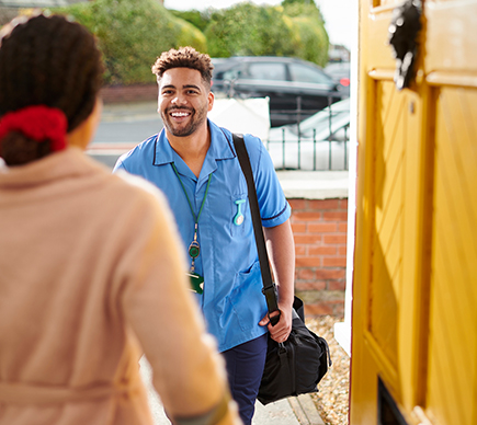 A male nurse arriving at a patient's home.