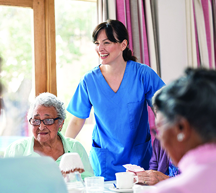 A nurse with two elderly patients.