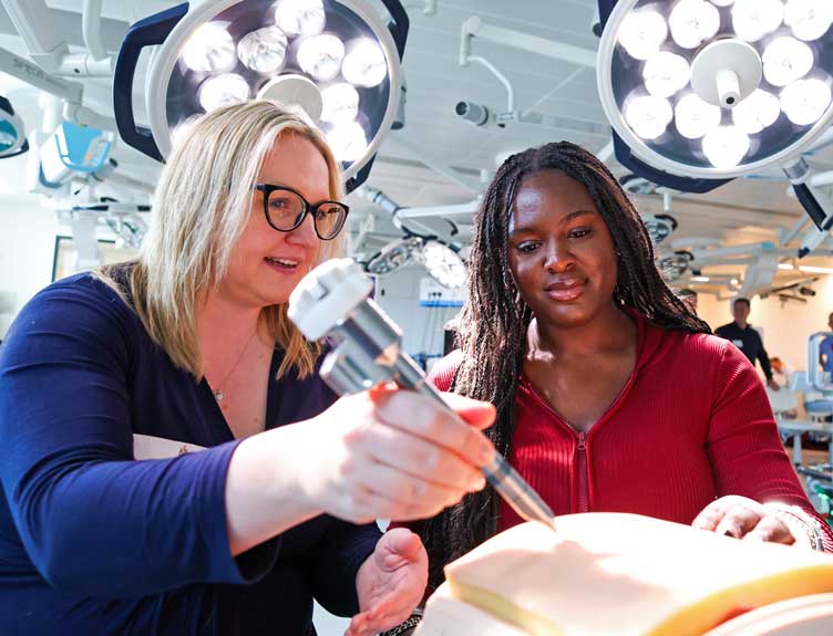 Robotic workshop Two individuals during a robotic workshop session